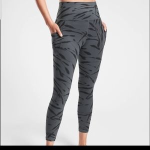 Athleta salutation stash pocket  zebra leggings